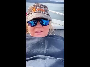 The outrageous moments of the slut who gets down with her dog after biting a fish in her pussy