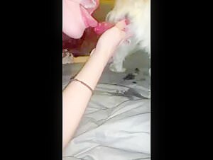 Bestiality video with a young woman and her dog