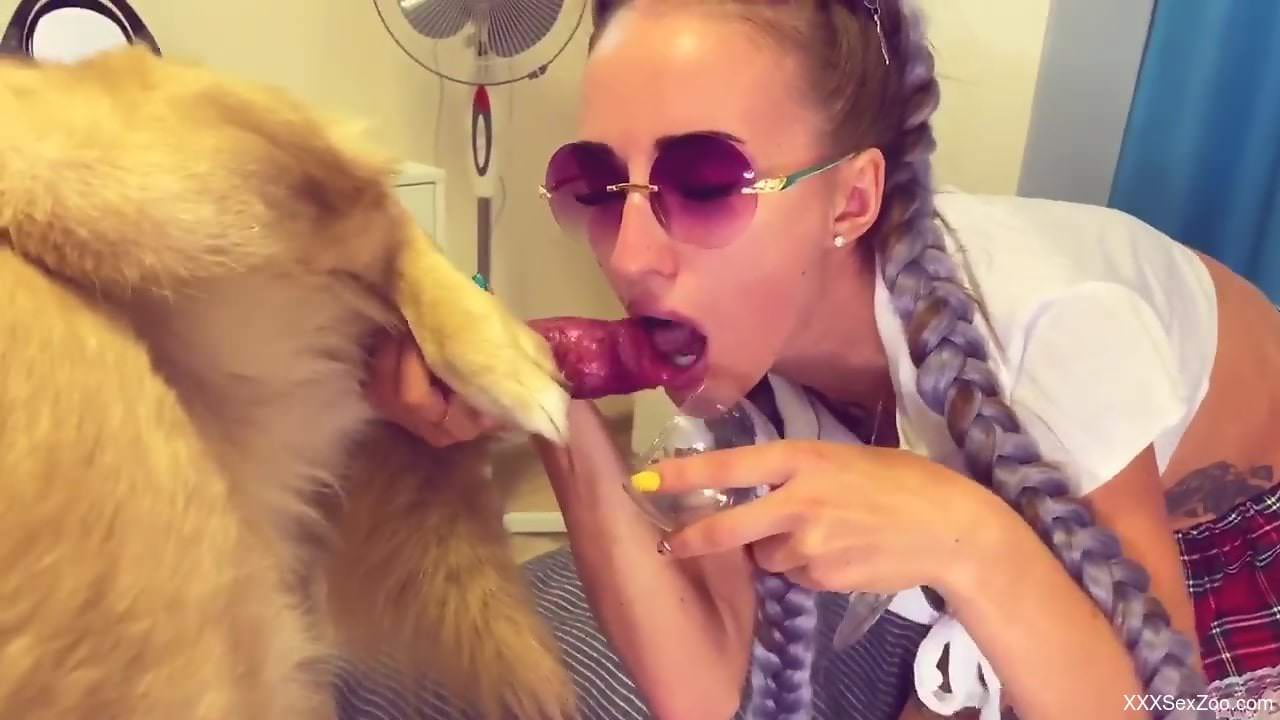 Braided zoophile beauty enjoying oral with a dog