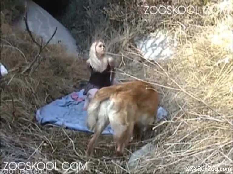 Pretty-looking blonde in a skirt blows a dog