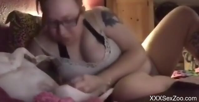 Hot busty female sucks her dog's wet cock in homemade solo