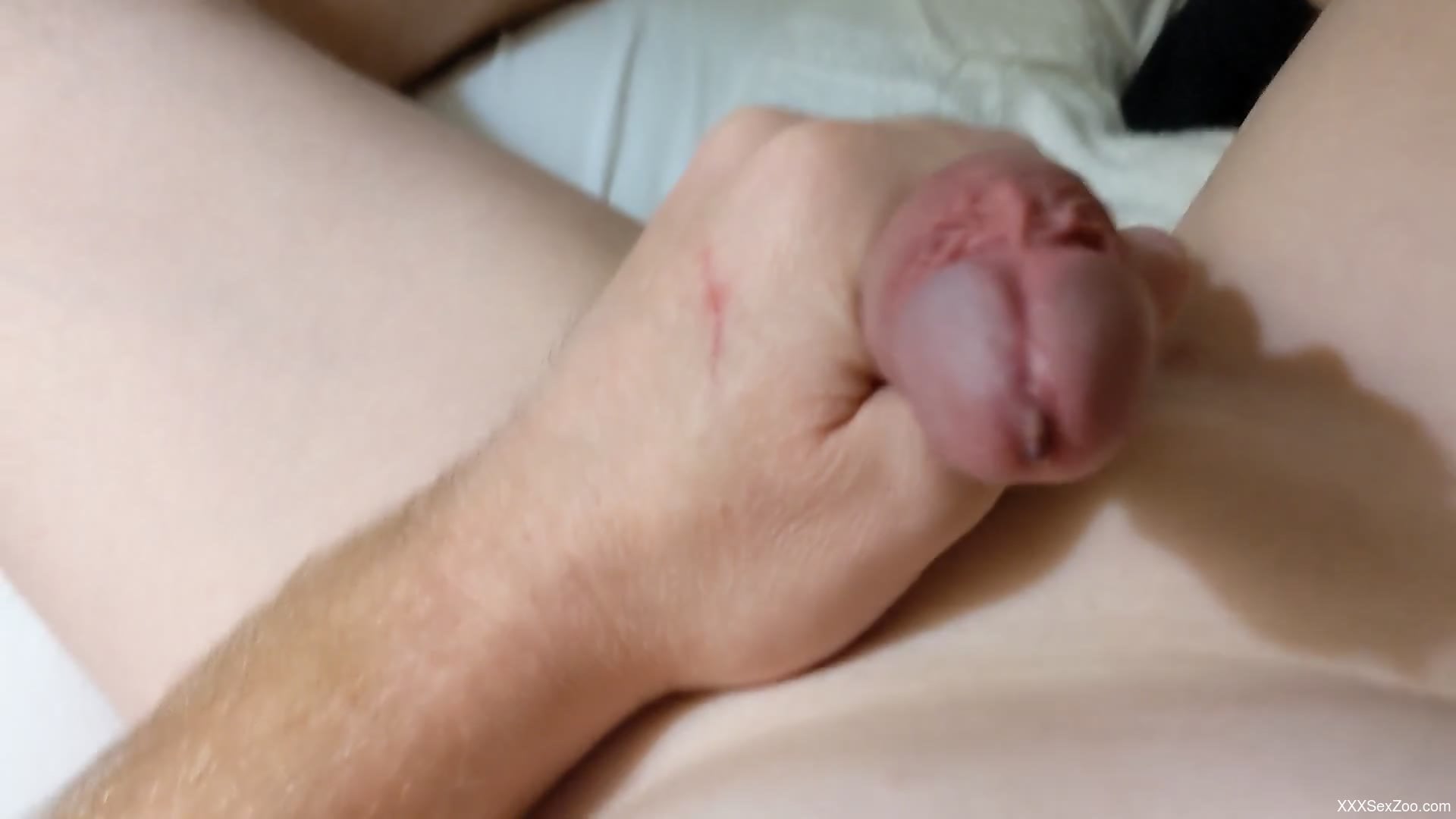 Dude strokes his dick with a worm inside crawling
