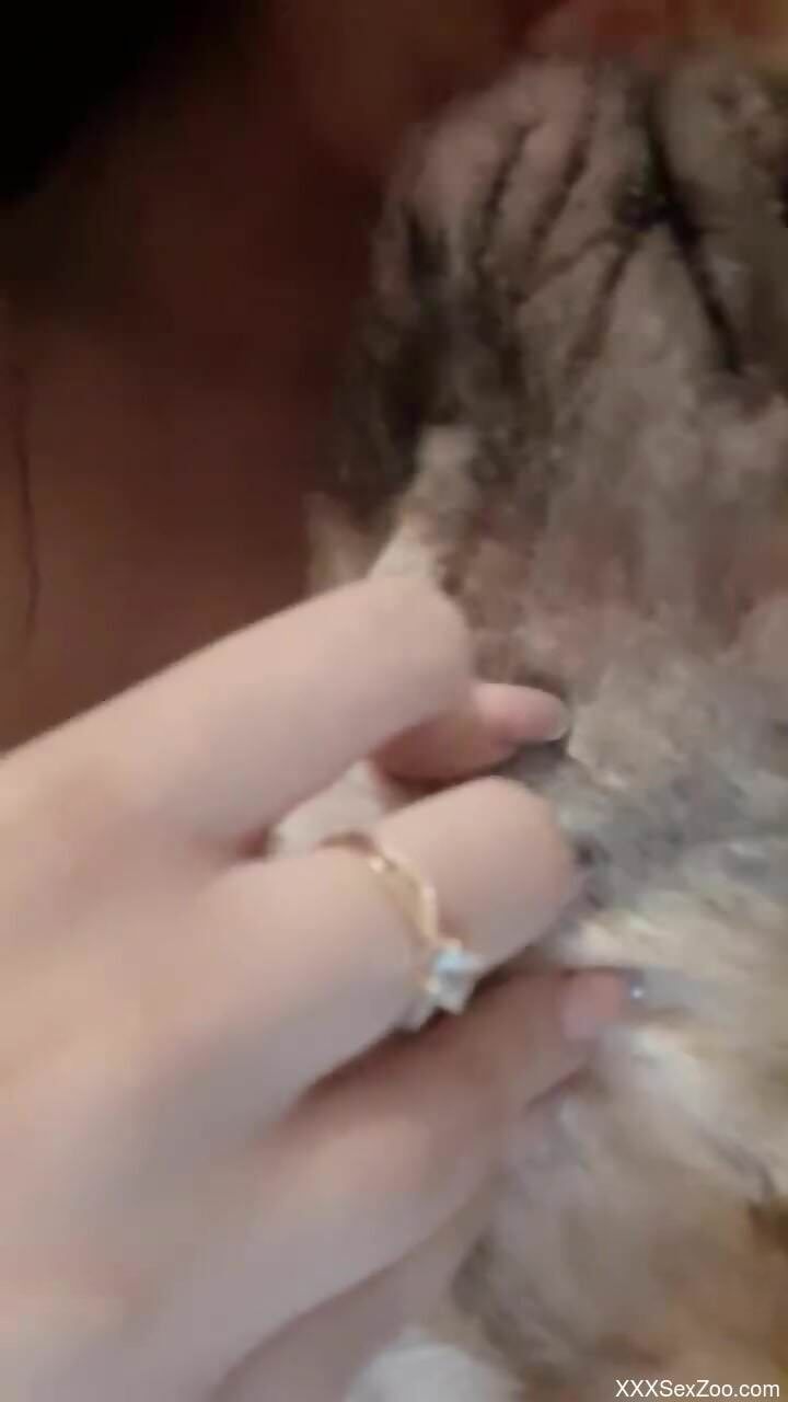 Nude woman enjoys zoophilia oral fantasies in a homemade play