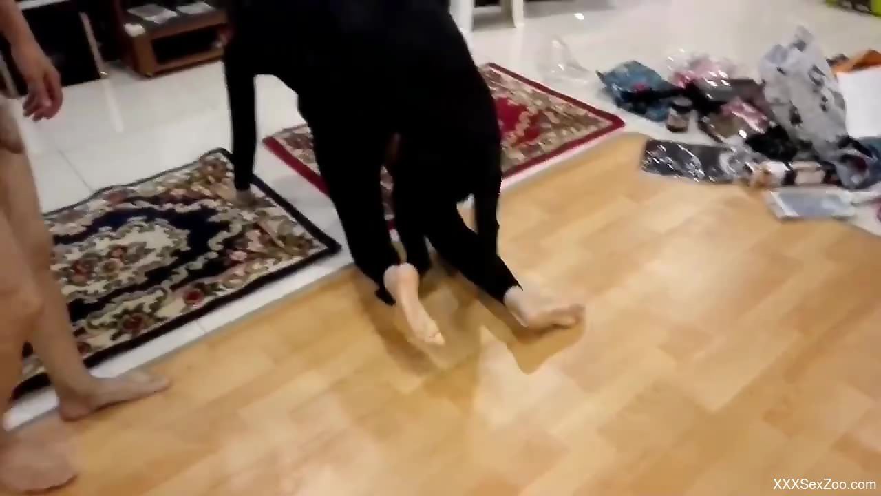 Hot babe in a bodysuit fucks a dog once again