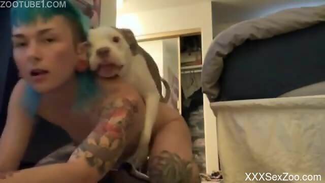 Dog makes inked woman feel amazing while nude on cam